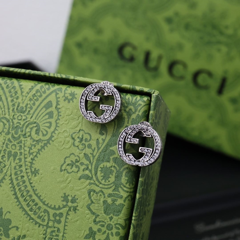 G*u*i earrings